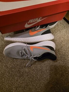 Nike Grey Running Shoes with Orange Swoosh